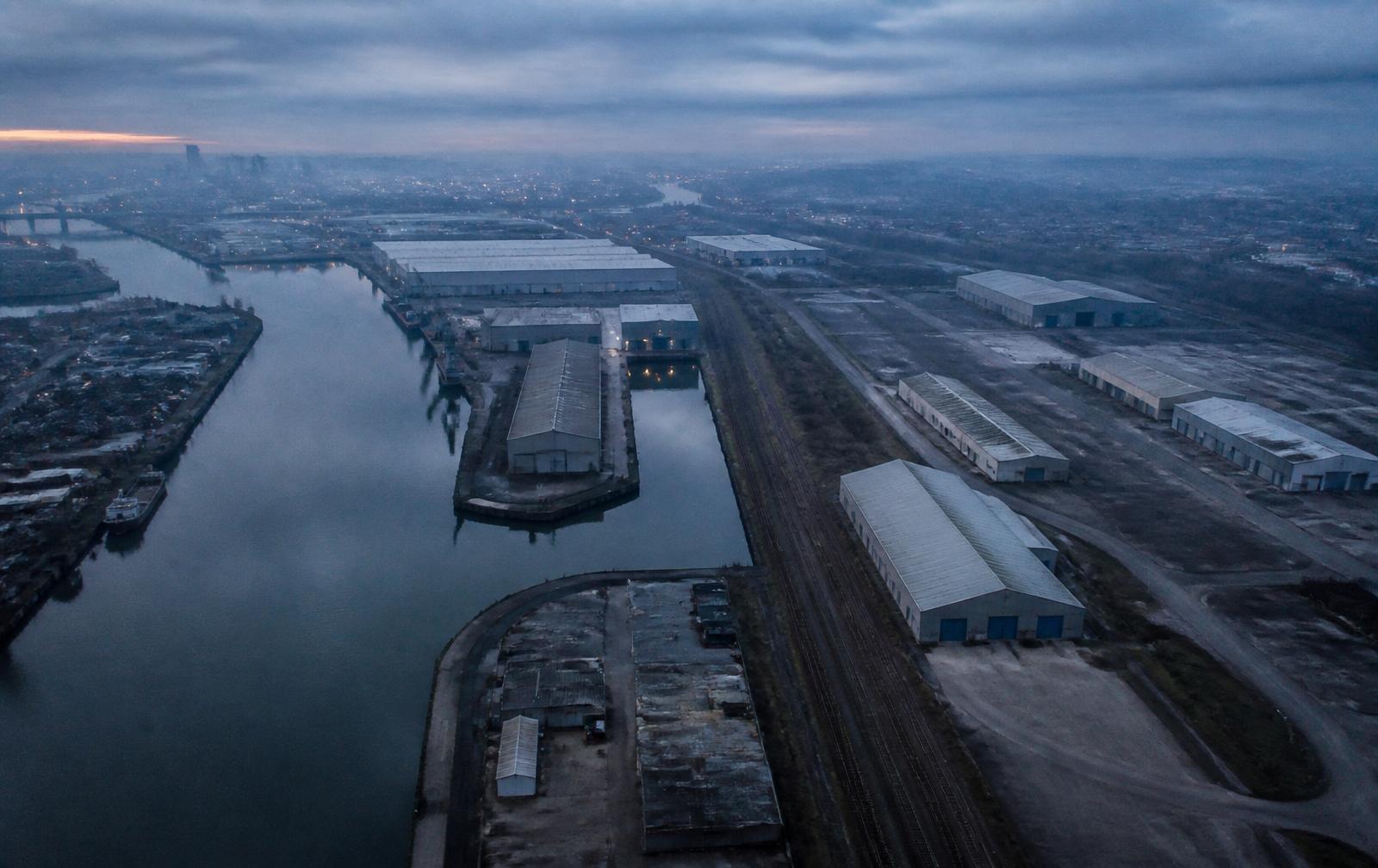Aerial view of the Manchester Ship Canal and Trafford Wharfside warehouses at dusk